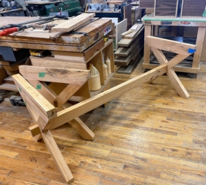 For all the legs and trestles, Peter needed to glue up pieces to gain the desired thickness. Balancing is very important here as an unbalanced board will warp.