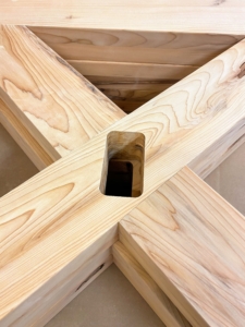 Holes are made in the criss-crossed center of the trestles for the horizontal support.