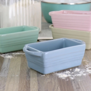 From Wayfair, you'll love my Martha Stewart mini loaf pan bakers. They're perfect for cooking individual bread portions. These bakers are not only functional but also stylish, designed with a colored stoneware finish and embossed outer stripe so you can take your dish straight from the oven to the table.