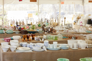 Look at all the dishes, pottery, and lamps for sale - nearly every item was sold from these tables. (Photo by Mke Krautter)