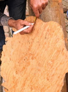 The wooden mount is marked where the holes match up to those on the piece.