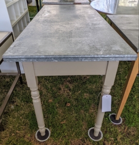 A galvanized metal topped table... for sale!