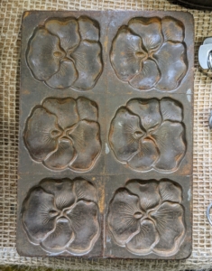 A cast iron poppy mold... for sale!