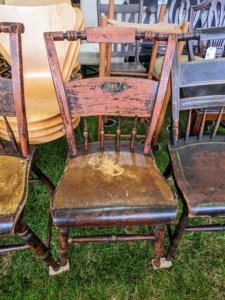 So many antique wooden chairs... for sale!