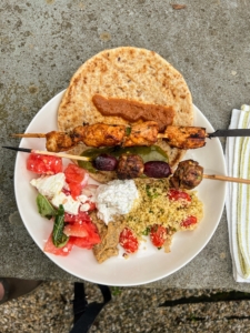 All our plates were filled, and then filled again. Here is my plate with a large pita bread, tzatziki, meat kebabs, and couscous. Also on the skewers - grilled grapes, inspired by recipes from Chef Yotam Ottolenghi. Everything was so flavorful.