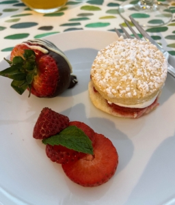 And for dessert, a trio of strawberry delights - a mini strawberry shortcake, a fresh strawberry and a strawberry dipped in chocolate.