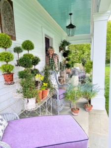 Here I am on the porch at Clove Brook Farm, the gorgeous home of my friends Christopher Spitzmiller and Anthony Bellomo. All the topiaries and potted plants surround the chairs and chaise longues.