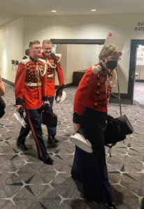 Here are members of the United States Marine Band and Joint Armed Forces Color Guard - all entering the ballroom with their instruments in tow.
