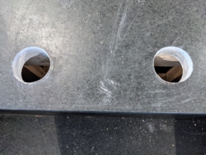 Then, my property manager, Doug White, who is very handy, carefully made two holes for the new faucets. These holes are 2 and 1/4 inches in diameter.
