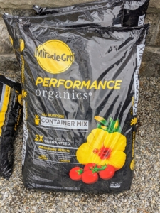We use Scotts Miracle-Gro Performance Organics Container Mix made with natural, organic aged compost. Find it on Martha.com.