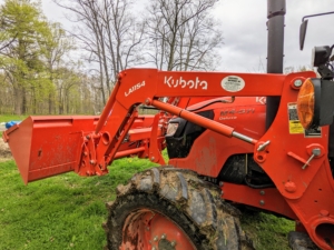The other end of the tractor has our trusted Kubota L1154 front loader that helps us transport so many things around the farm, including more bags of seed, which cuts down plenty of time going back and forth to the Equipment Barn.