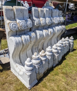 At another tent, architectural pieces such as these giant corbels. A corbel is a structural piece of stone, wood or metal jutting from a wall to support weight, similar to a bracket.