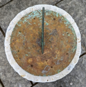At the end of the footpath is this antique sundial. A sundial is any device that uses the sun’s altitude or azimuth to show the time. It consists of a flat plate, which is the dial, and a gnomon, which casts a shadow onto the dial.