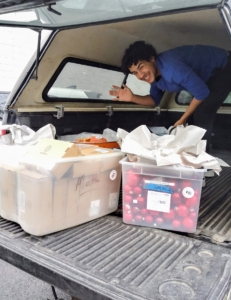 This is Irving Sanchez from The Benefit Shop Foundation helping to unload some of the bins of holiday decorations at the nearby Mt. Kisco gallery.