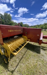 And here is the baler. A baler is a piece of farm machinery used to compress a cut and raked crop into compact bales that are easy to handle, transport, and store.