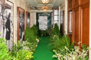 The event was held in the Oak Room of the prestigious Plaza Hotel NYC. The hallway leading to the Oak Room was filled with lots of greenery, and a large photo of Mario Badescu himself. (Photo by Rupert Ramsay/BFA.com)
