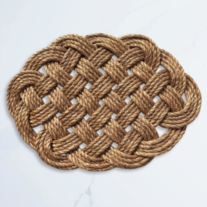 This is a hand-woven doormat. Borrowing from the seafarer’s toolkit, their wares are constructed by hand of natural rope.