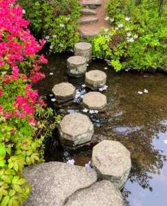 Quaint stone steps allow visitors to cross the stream.