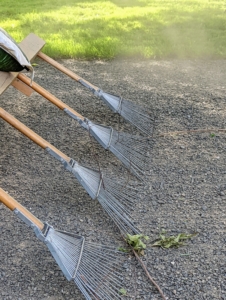 It is made from four soft garden rakes attached to a wooden frame. It is crucial to maintain gravel roads, so water can flow properly during storms.