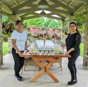 Elvira and Enma always set up beautiful table scapes. Here they decorated my new yew table under the pavilion with silver vases of roses just picked the previous day. They served citrus infused ice water to all the guests.