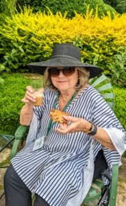 My dear friend, Memrie Lewis helped to host the garden tour in my absence. Here she is enjoying a pastry and a glass of iced coffee.