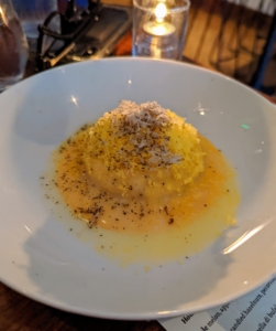 We ordered ravioli al'uovo or raviolo with an egg yolk. This one was served with ricotta and a dusting of fresh black truffle.