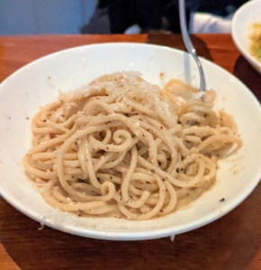 For our entrées, we decided to order one of each pasta and share on small plates. This is bucatini cacio e pepe. I love bucatini pasta. Bucatini, also known as perciatelli, is a thick spaghetti-like pasta with a hole running through the center of each strand.