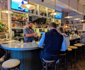 Inside is a cozy bar. Some of its popular cocktails include Rosina's Garibaldi which is made with Campari and fluffy orange juice. Rosina's beverage director, Juan Meyer, is tending the bar.