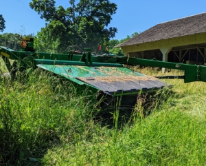 I am fortunate to have all the necessary equipment here at the farm. This is our mower-conditioner. Mower-conditioners are a staple of large-scale haymaking. It cuts, crimps, and crushes the hay after it is cut to promote faster and more even drying.
