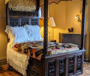 On this bed, another quilt created by one of the woman servants. Quilting was influenced by a need to provide proper cold weather bed coverings, but over time, also became a very artistic and expressive art form.