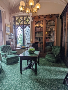 This green parlor and sitting room includes something very special. Take a look at the back left corner...