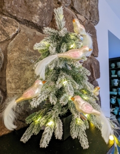 This is my 16-inch Down Swept Flocked Tabletop Tree with 30 battery-operated LED lights. Place it on the mantel, bookcase, or table and decorate it with clip-on birds.