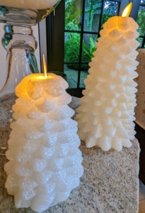 I also offer sets of two Glittered Holiday Tree Pillars in six-inch and nine-inch sizes. These are white, but they also come in silver, champagne, and gold. And they run on a multi-timer remote control.
