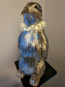 This is one of a pair of Tinsel Fur Penguins. My Color Change Globe Lights look so fanciful used as a necklace.