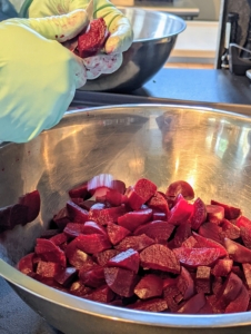 Inside my Flower Room kitchen, Chef Pierre Schaedelin from PS Tailored Events, cuts the beets into bite-sized pieces for a delicious salad.