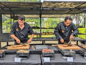 Asado chef, Pablo Calandroni, and his sous chef, Kevin Thomas, cut all the meats for the buffet as soon as they were done cooking.
