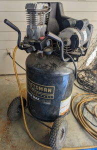 For this job, we needed a strong air compressor. Air compressors work by forcing air into a container and pressurizing it and then pushing it out though the tank and the paint sprayer.