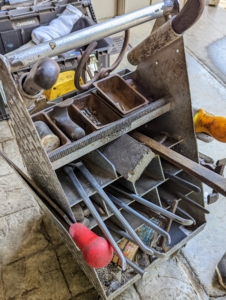 A farrier always has his or her box of important tools. When we see this in the stable, we know our farrier is not far away. Among the implements needed to change horseshoes are the pullers, a clinch cutter, a brush, and a rasp.