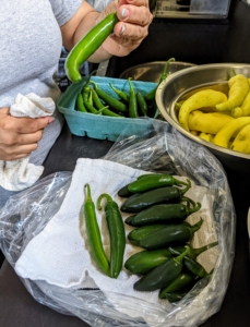 She does them same for these peppers. Be careful when picking peppers – always keep the hot ones separated from the sweet ones, so there is no surprise in the kitchen.