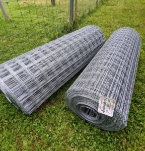 The next step is to install the fence fabric. This is 4x4 inch wire fencing. Each roll is 60-inches wide and 200-feet long.