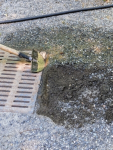 Pete also cleans the edges of the catch basin and shapes the area for better drainage during storms. A catch basin, or storm drain, redirects rainwater to prevent ponding and flooding.