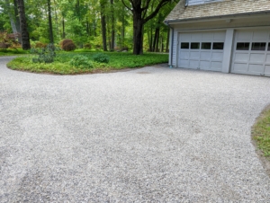 After a few hours, the driveway looks completely different with its new surface layer of gravel - another important task checked off our list.