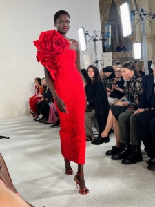 There was also this strapless bold red dress with a sculptural red rose detail over one shoulder.