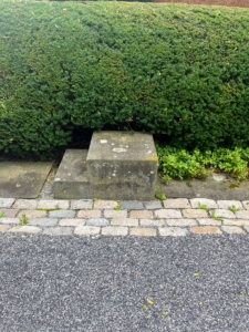 This stone step mounting block shows visitors entering or exiting that the owner had horses, and in this case, a collection of riding carriages.