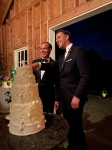 Here are the grooms cutting their "faux bois" wedding cake with meringue mushrooms. The couple made the cake themselves. An outer layer of whipped cream concealed a rich black forest cake of chocolate layers filled with more whipped cream and sour cherries.