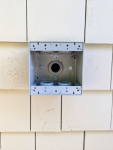 The entire installation process takes less than an hour to complete. The first step is to select a location - this wall next to my carport is perfect because it is convenient to reach and close to the entrance of my home.