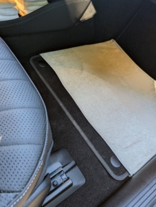 Andres places a towel on the floor of both the driver’s side and the front passenger side seats – with the ends tucked under the car’s floor mats. Towels keep the area clean and are easy to pick up and throw in the wash at the end of the day.