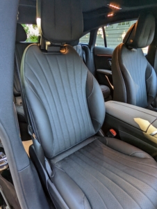 The front seats feature adjustable lumbar supports, side bolsters, and shoulder supports -all great for those long rides. And, guess what? It also has a built-in massager.