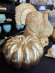 I love this gold pumpkin and turkey. The Resin Gilded Pumpkin comes in a set of two. The large measures 10-inches by six-inches and the small is 7.5 inches by five-inches. The Resin Gilded Turkey Figure stands a foot tall. Both are great to use as holiday table centerpieces or to decorate a shelf for the entire autumn season.