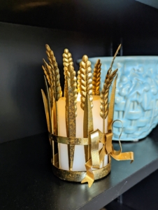 And this is my elegant seven-inch Metal Wheat Votive Holder. It fits best with a flameless four by three inch pillar candle.